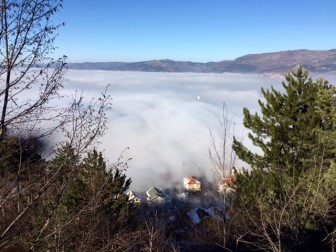 Fogged-in Sarajevo as seen from Trebevic Mountain.