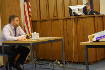 Dr. Matthew Davis is pictured testifying at Eric Largy's recommittal hearing on Thursday in Merrimack County Probate Court with Probate Judge David King on the bench.