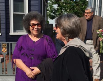 Valerie Cunningham, founder of Portsmouth Black Heritage Trail is pictured talking with a woman at Monday's ceremony.