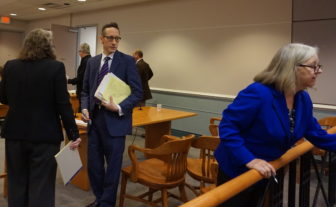 Prosecutor Michele Battaglia, left, and Public Defenders Michael Davidow and Suzanne Ketteridge are pictured at a recent hearing in Hillsborough County Superior Court in Nasha. Eric Largy is pictured exiting in in the background.